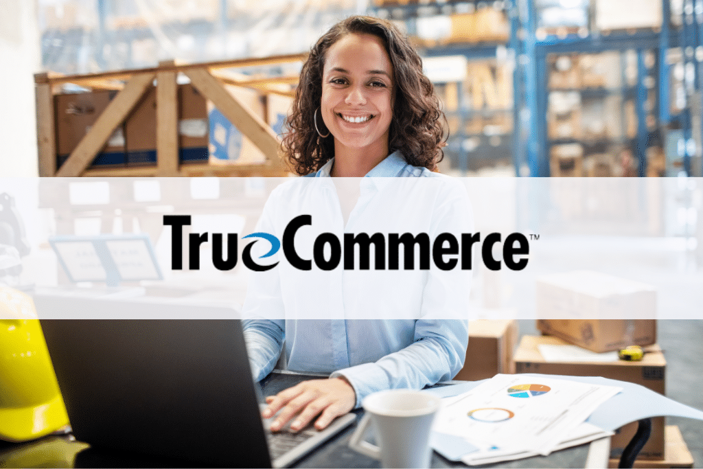 TrueCommerce logo over woman smiling on warehouse