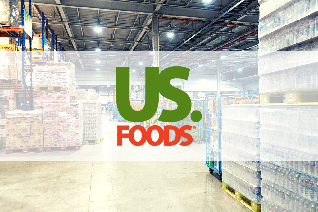 a picture with the Us foods logo with a warehouse as background