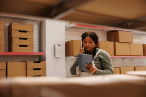 woman in warehouse practicing good inventory management