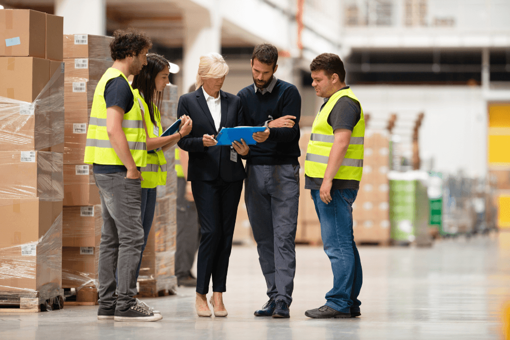 wholesaler discussing landed costs with employees